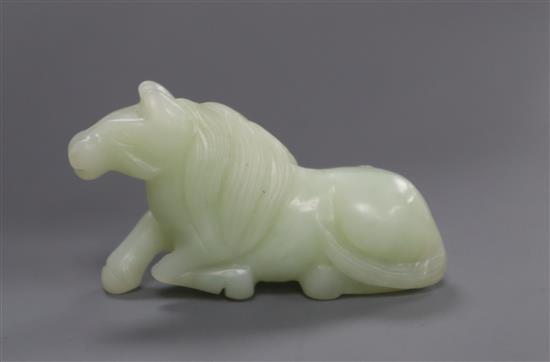 A Chinese jade figure of a recumbent horse length 7cm